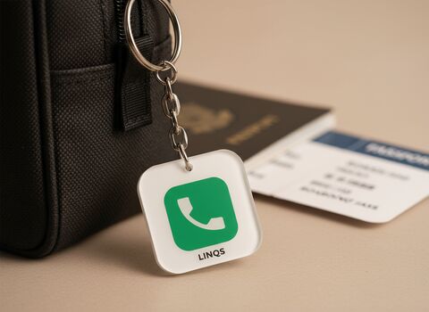 LessWorry square tag attached to a travel pouch