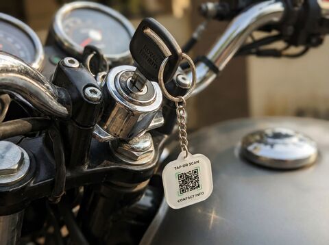 QR tag on Royal Enfield motorcycle key in ignition
